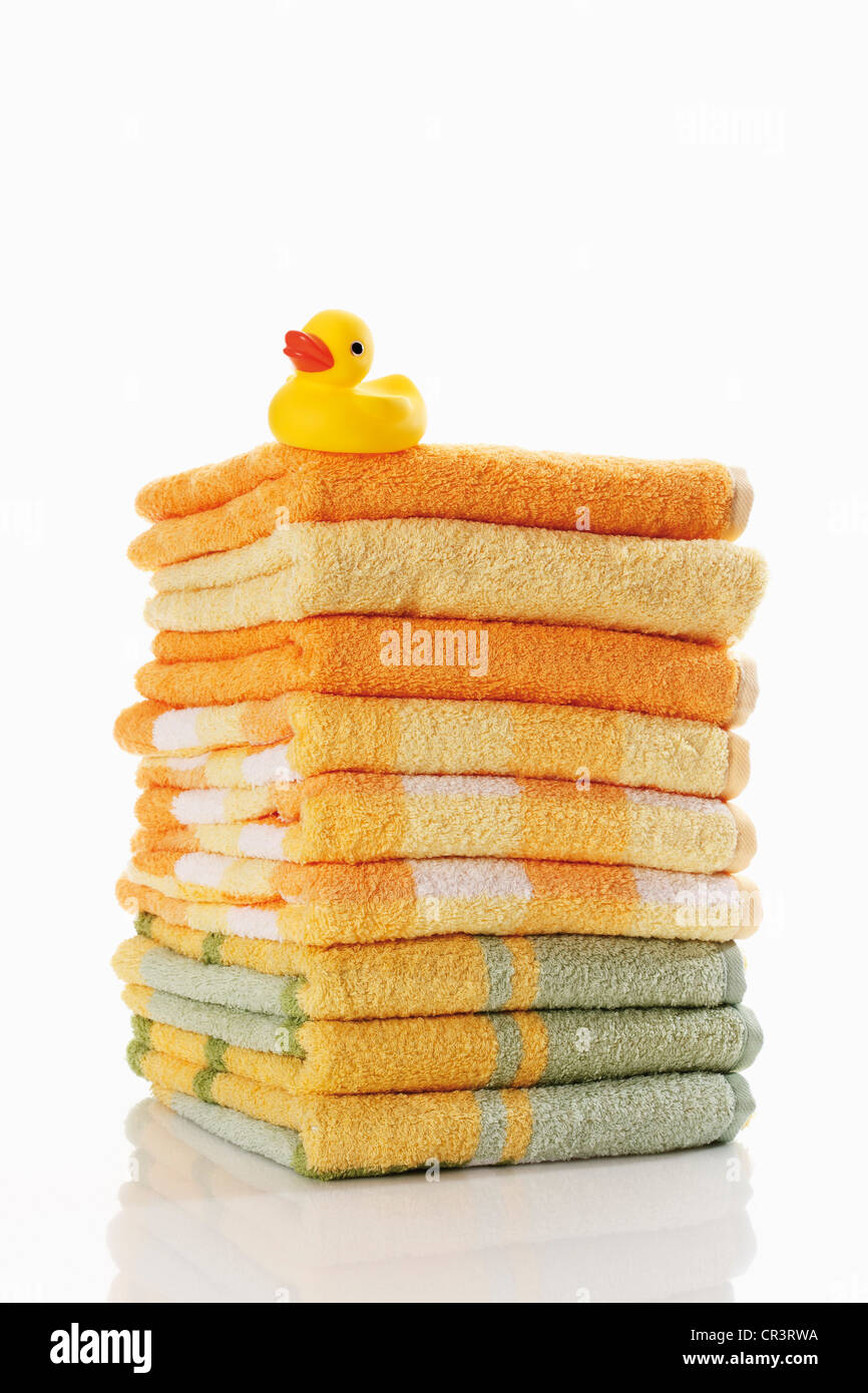 Stack of towels with a rubber duck Stock Photo Alamy