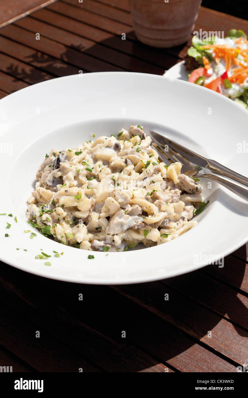 Spaetzle Swabian egg noodles with mushrooms and turkey strips in cream