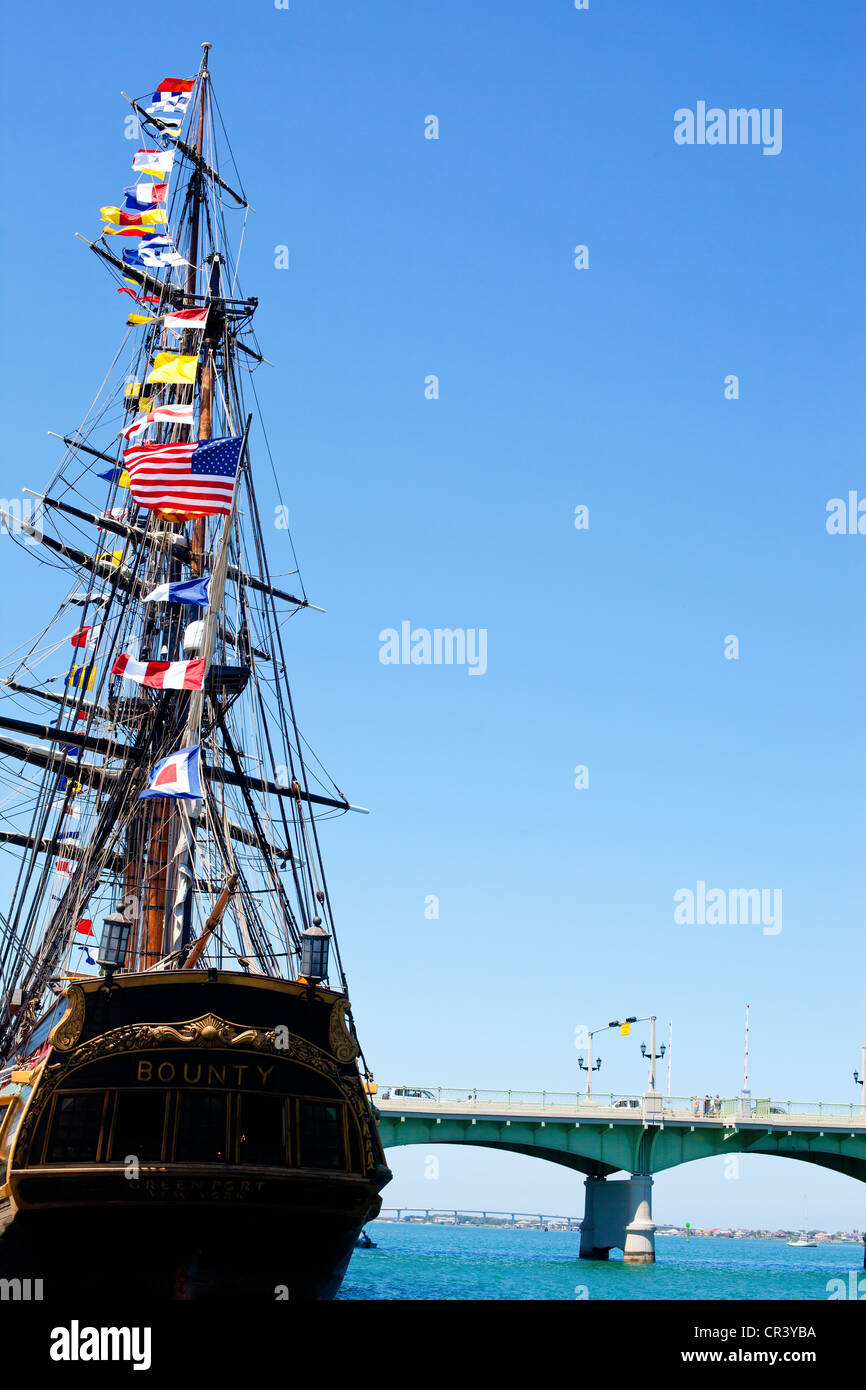 The tall ship HMS Bounty moored at St. Augustine, Florida. The Bridge of Lions is in the background Stock Photo