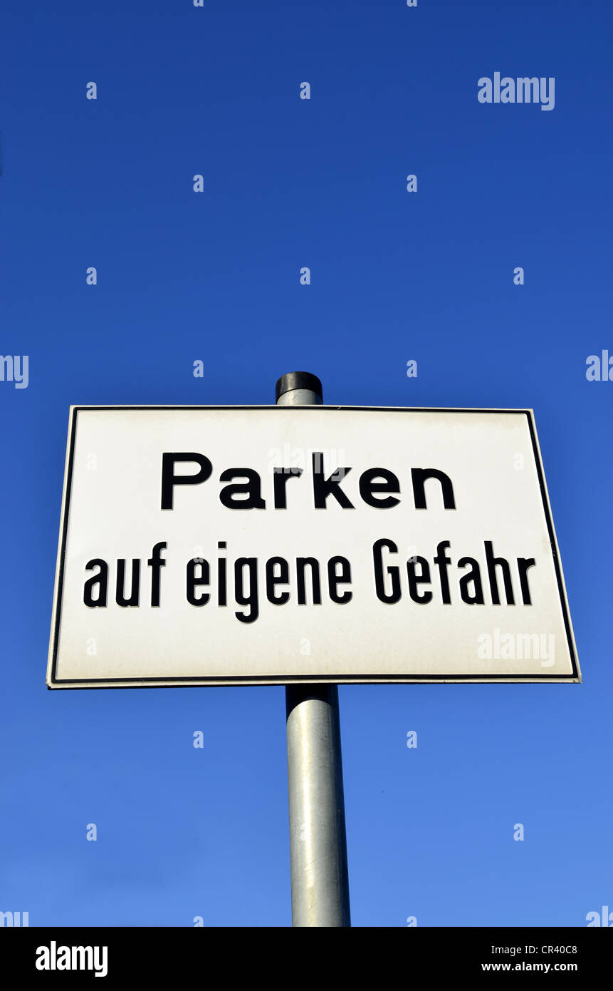 'Parken auf eigene Gefahr', German for 'parking at your own risk', Germany, Europe, PublicGround Stock Photo