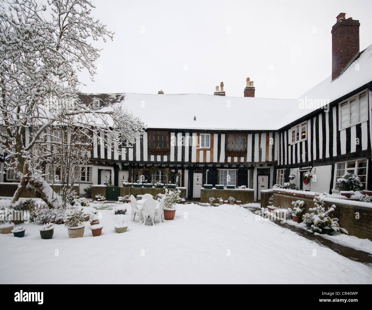 The Vicars Close of Lichfield Cathedral under a blanket of winter snow showing Tudot half timbered buildings Stock Photo