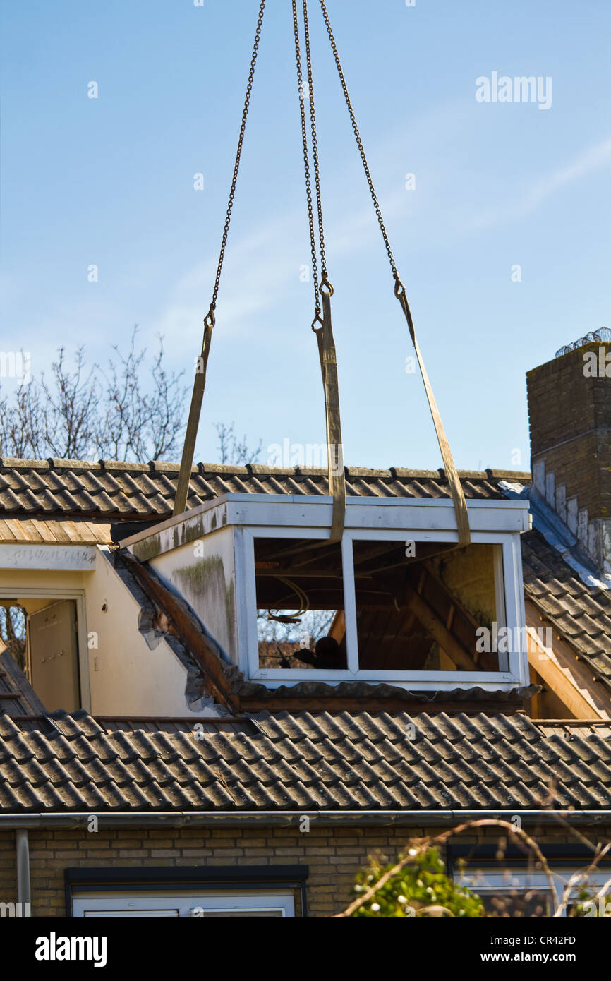Old dormer-window is lifted - vertical image Stock Photo