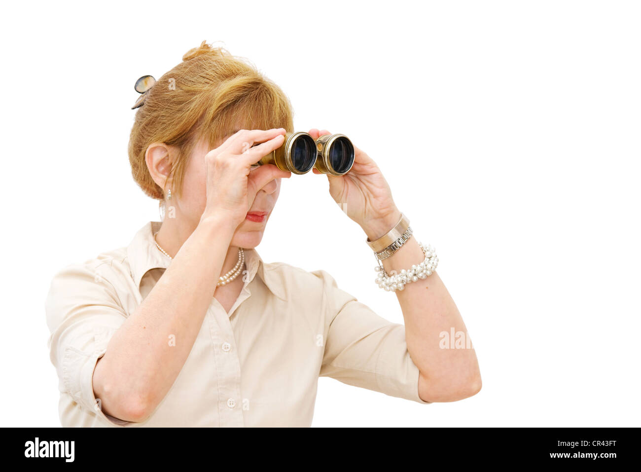 In search for success - mature businesswoman looking through binoculars. Isolated over white background with room for your text. Stock Photo