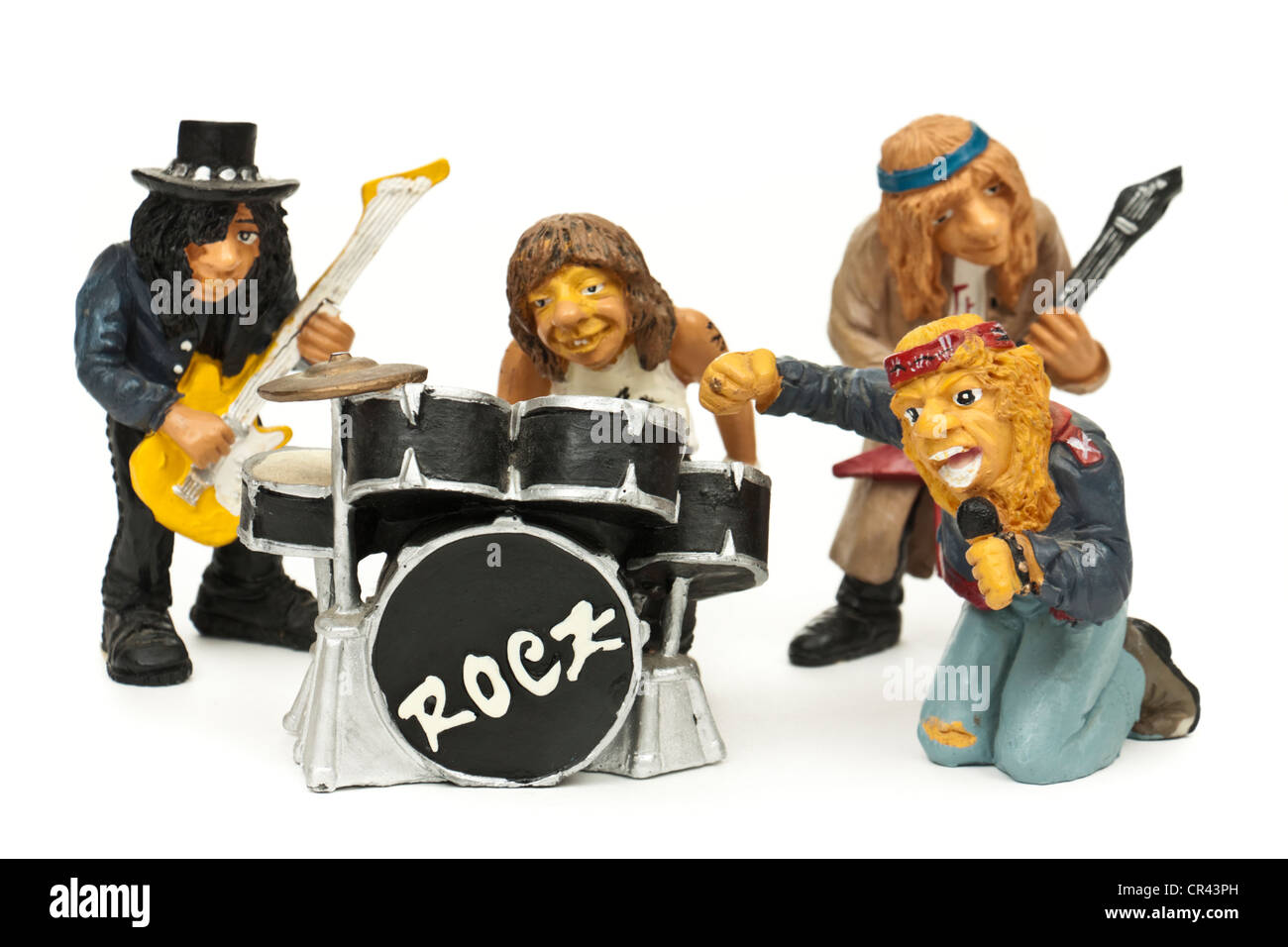 Miniature rock band with two guitarists, drummer and lead singer Stock