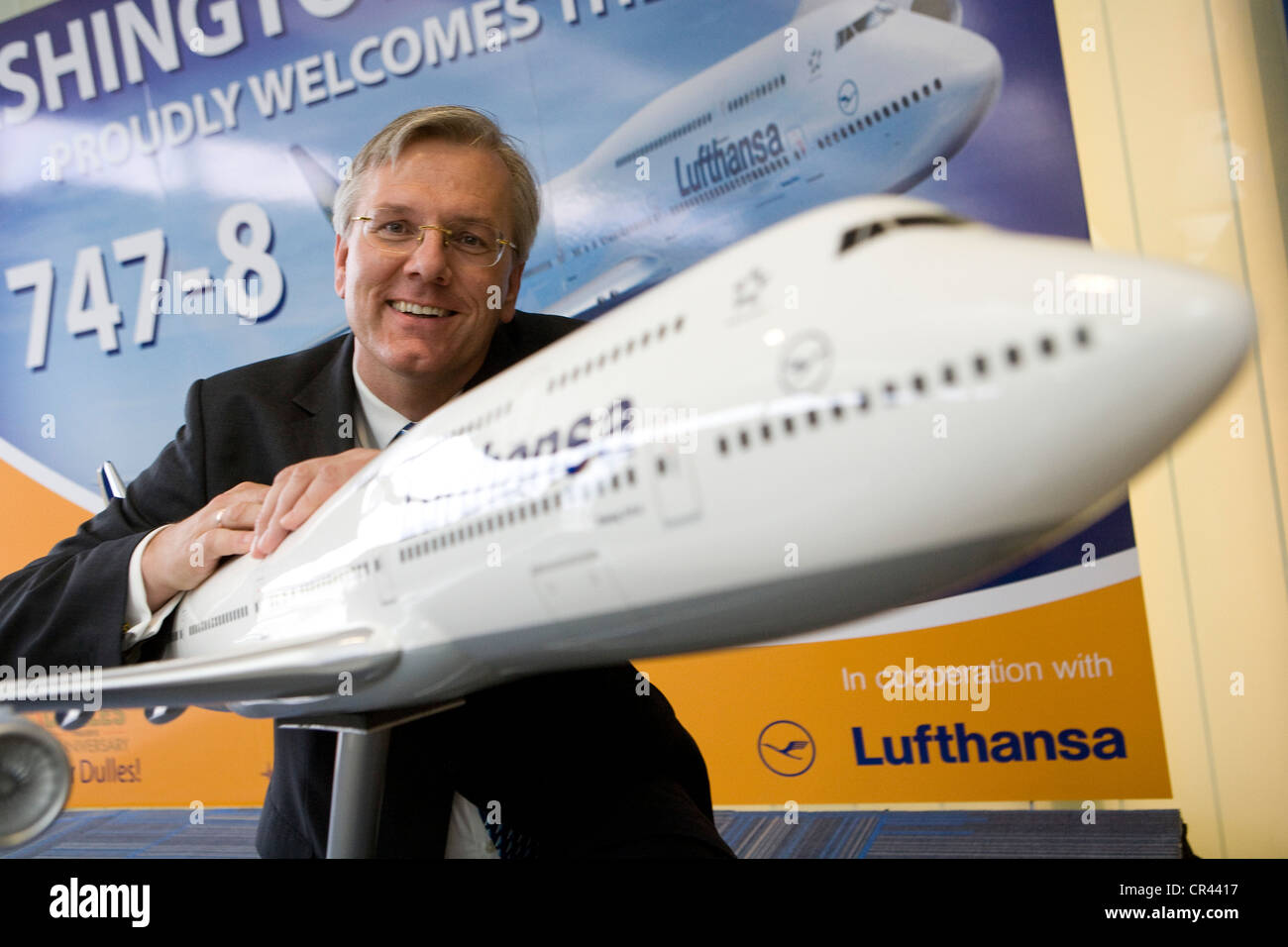 Christoph Franz, Chairman and CEO of Deutsche Lufthansa AG posing with a model of a Boeing 747-8.  Stock Photo