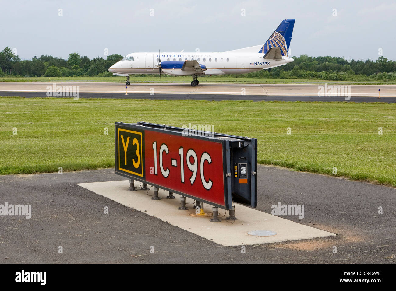 A United Express Saab 340B landing at Dulles International Airport. Stock Photo