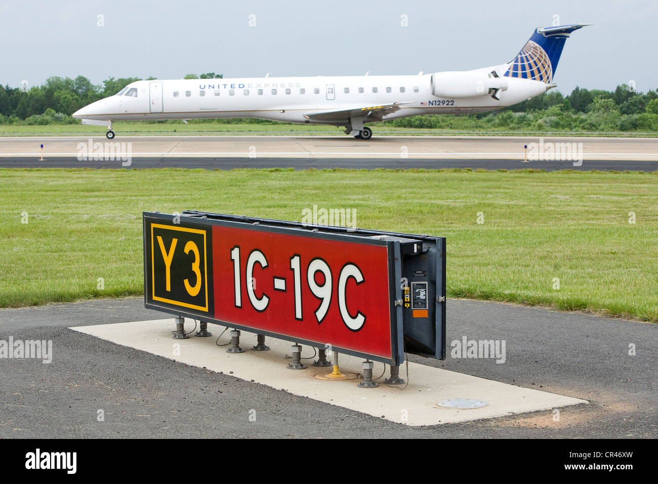 A United Express Embraer EMB-145LR landing at Dulles International Airport. Stock Photo