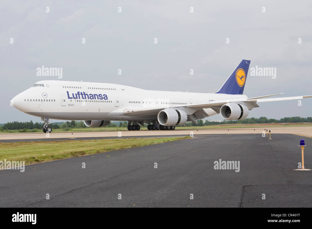 A Lufthansa Boeing 747-8 landing at Dulles International Airport on its first passenger flight. Stock Photo