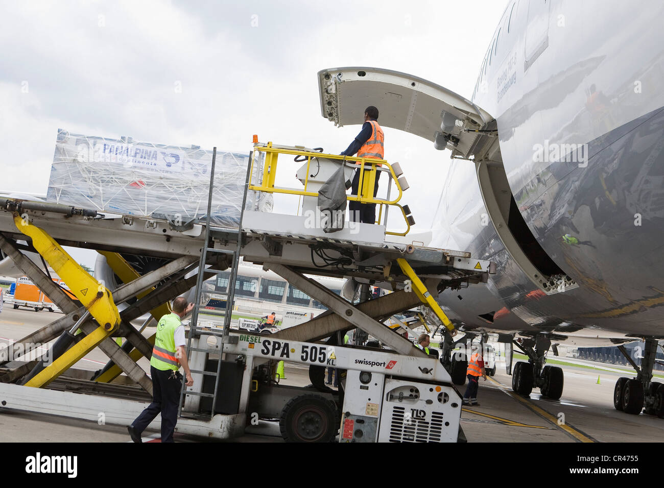 Cargo is offloaded from a Lufthansa Boeing 747-8. Stock Photo