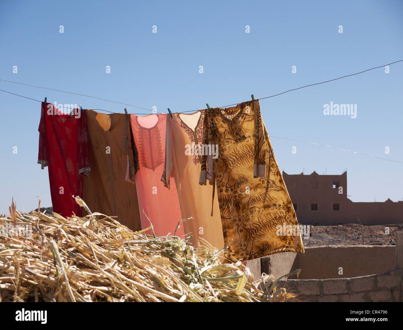 Colorful caftans hanging on a clothesline, Ouarzazate, Morocco, North Africa, Africa Stock Photo