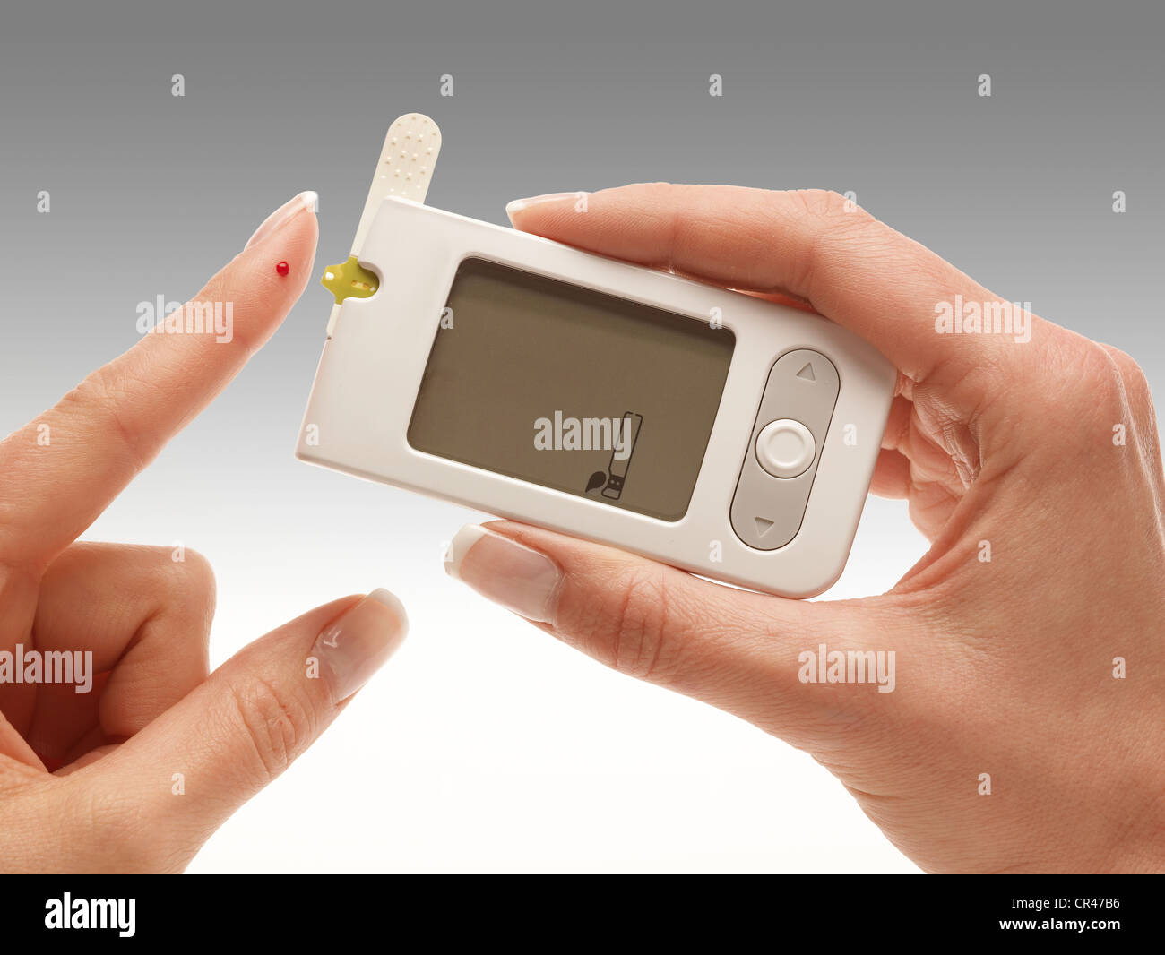 Blood glucose meter, finger test Stock Photo Alamy