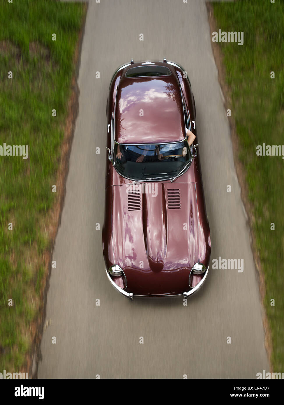 Jaguar E-Type, 1966 model, classic car, driving on a narrow asphalt road during an outing, Bad Homburg, Hesse, Germany, Europe Stock Photo