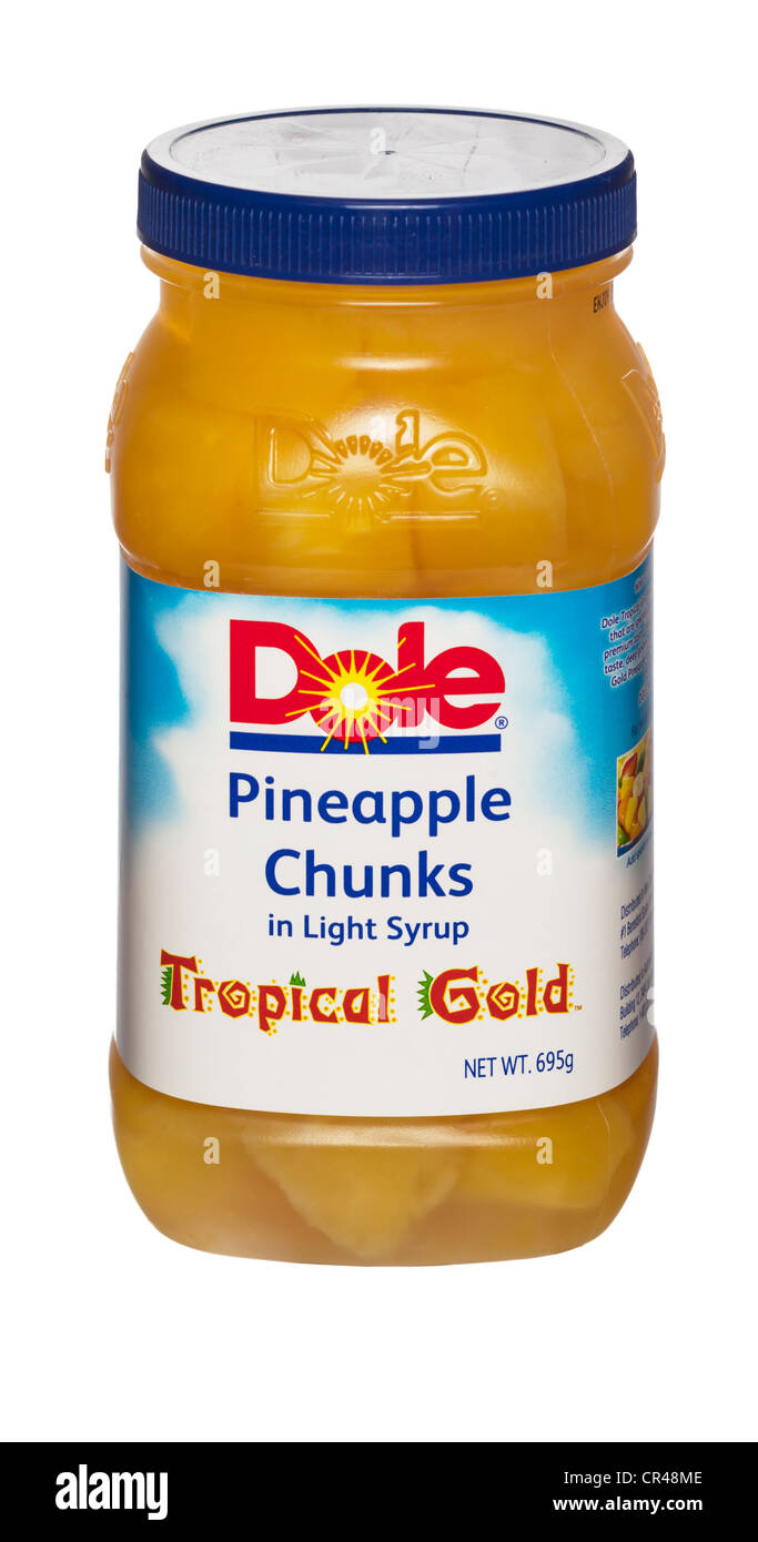 Dole Pineapple Chunks in Light Syrup Tropical Gold plastic container Stock Photo
