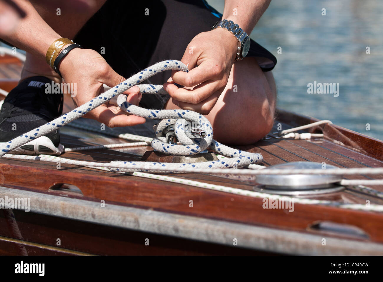 Person tying up boat hires stock photography and images Alamy