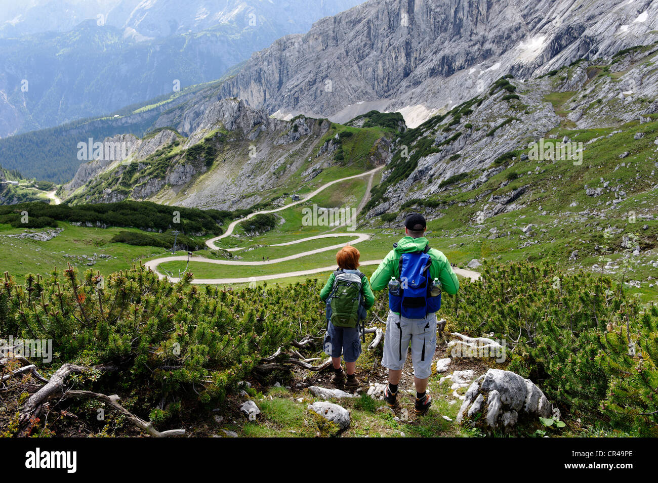 Father and son on the summit adventure trail of Alpspitzbahn, Garmisch-Partenkirchen, Wettersteing range, Upper Bavaria, Bavaria Stock Photo