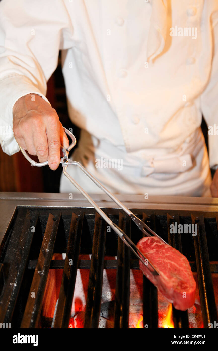 Chef Grilling Steak on Charcoal Grill Stock Photo Alamy