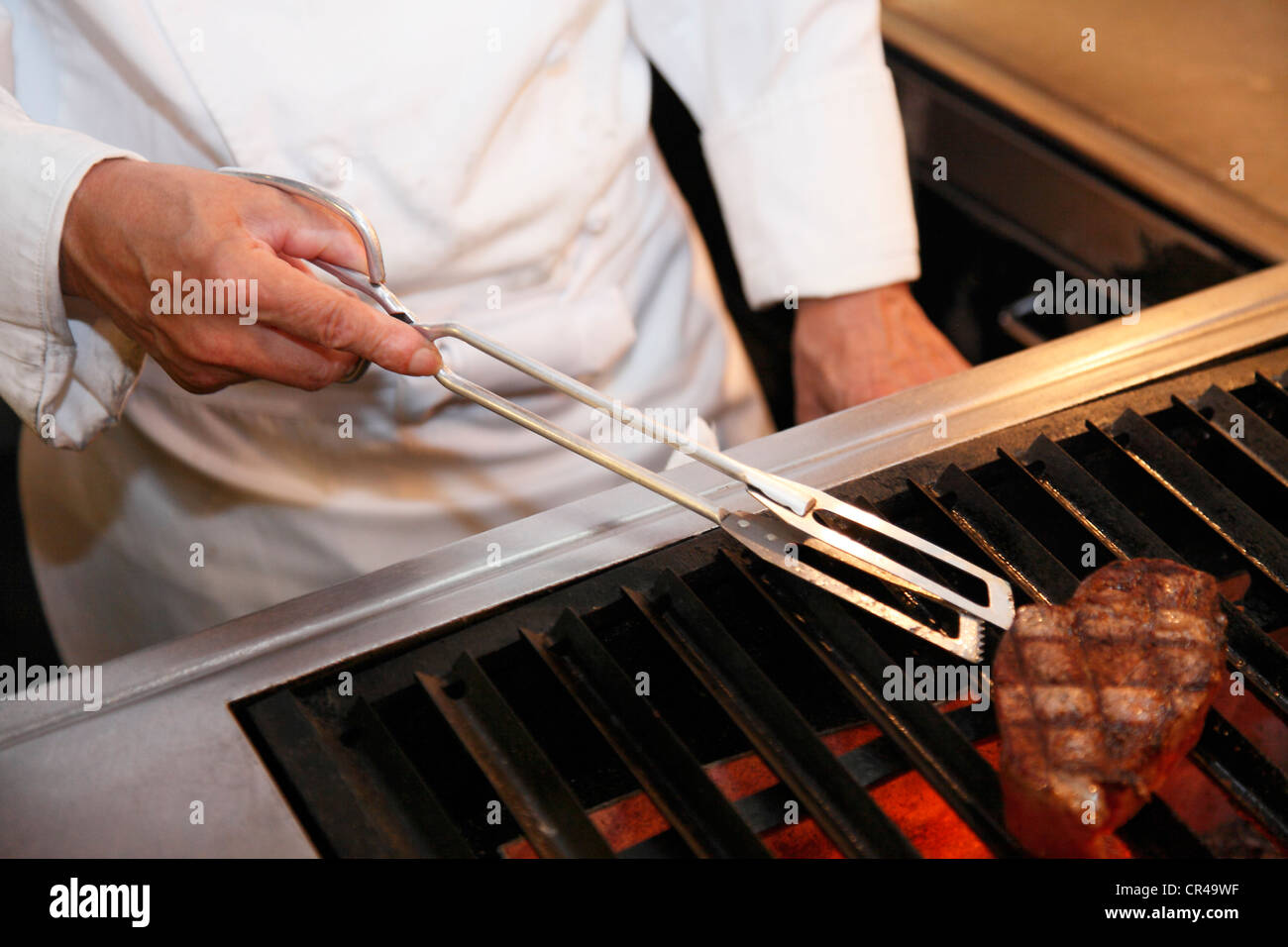 Chef Grilling Steak on Charcoal Grill Stock Photo Alamy