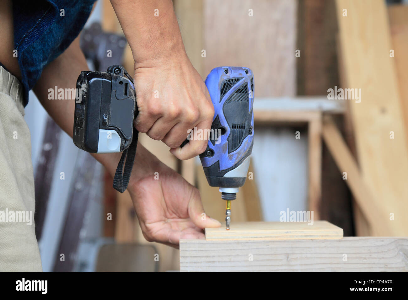 Cabinet Maker Using Nail Gun Stock Photo