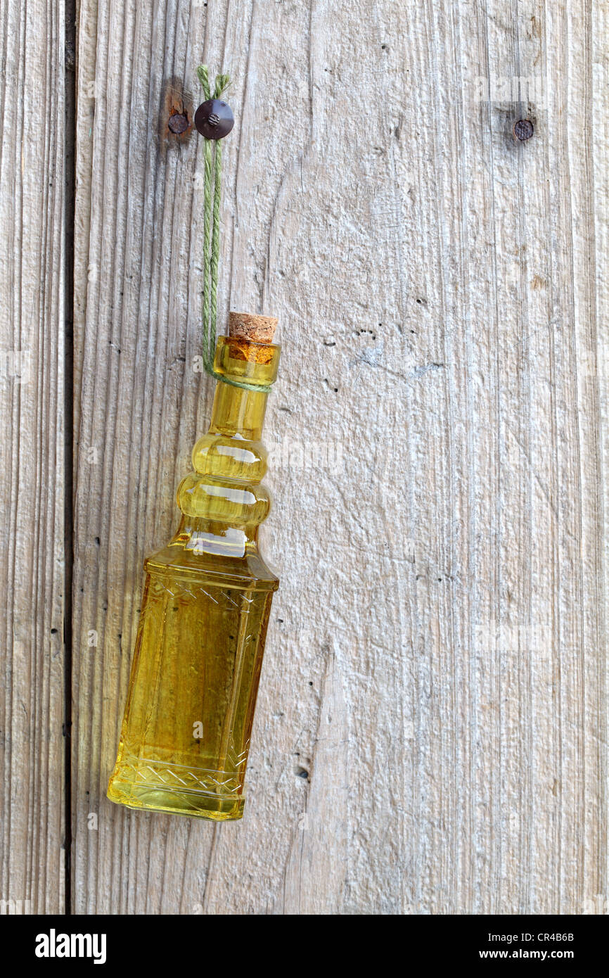 Vintage bottle hanging on the wooden wall Stock Photo Alamy