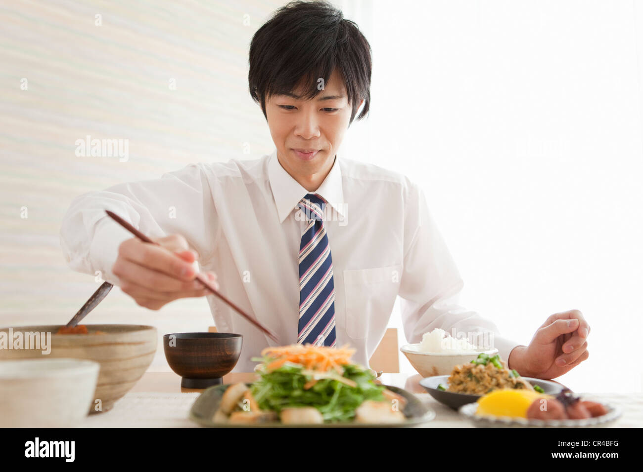 Young Man Eating Breakfast Stock Photo - Alamy