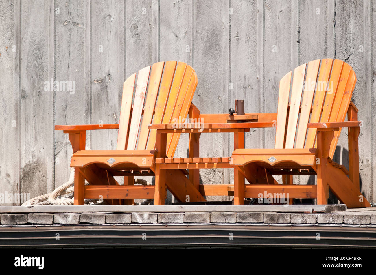 Two wooden chairs with a table Stock Photo Alamy