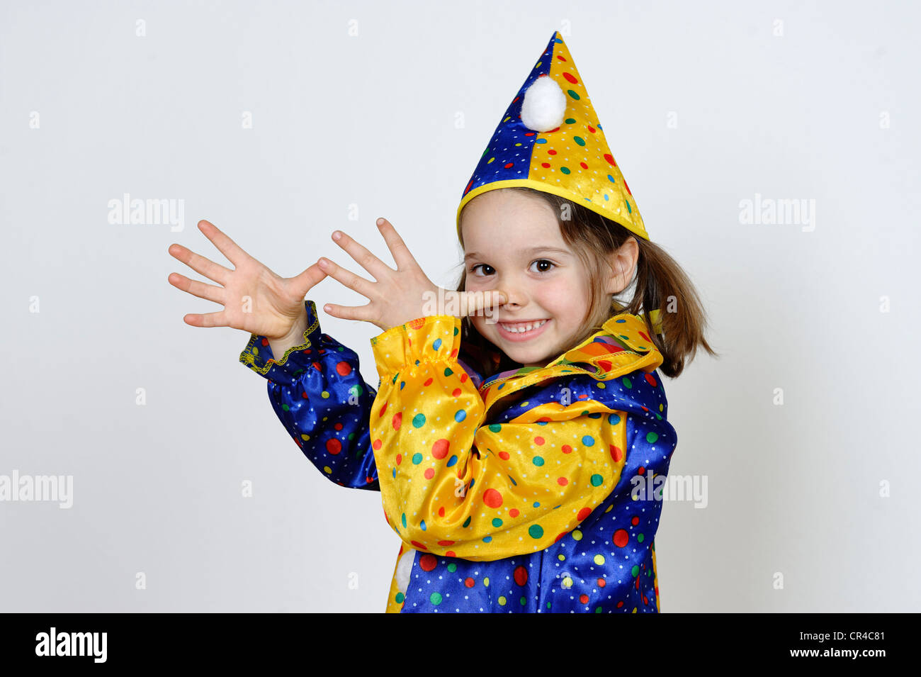 Girl dressed as a clown for carnival Stock Photo - Alamy