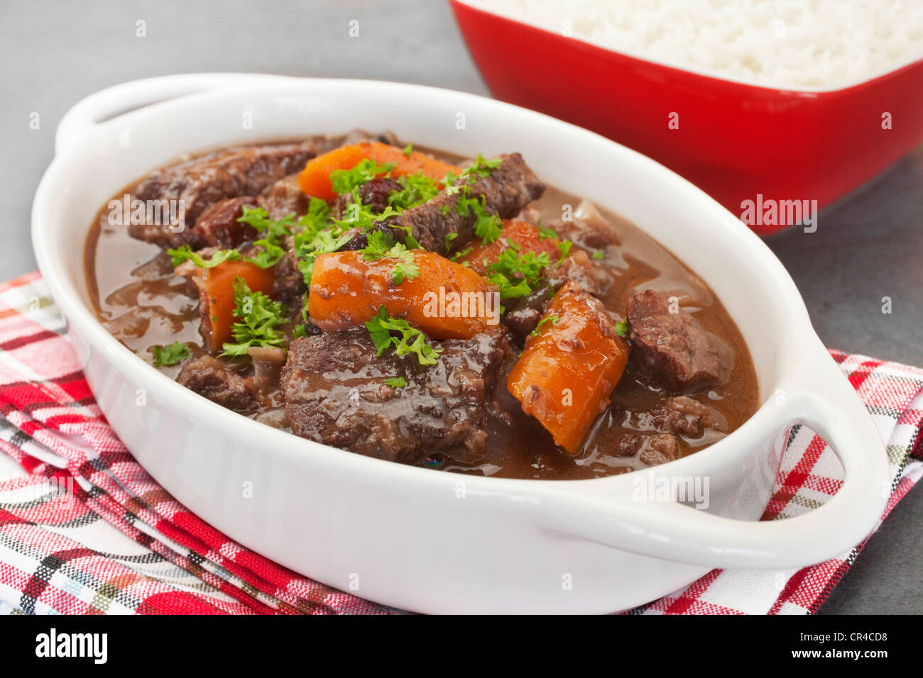 A French stew, daube of beef Provencal has a delicious sauce made from red wine, stock, cinnamon, cloves, orange and herbs Stock Photo