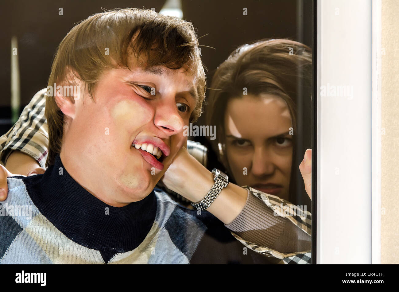 Office revenge: Woman pressed man to the glass Stock Photo