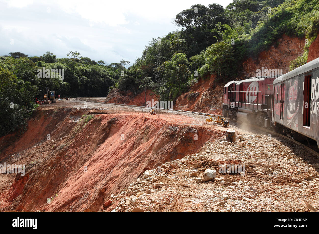 Train passing a landslide that devastated large tracts of land after heavy rains in the spring of 2011, historic railway line Stock Photo