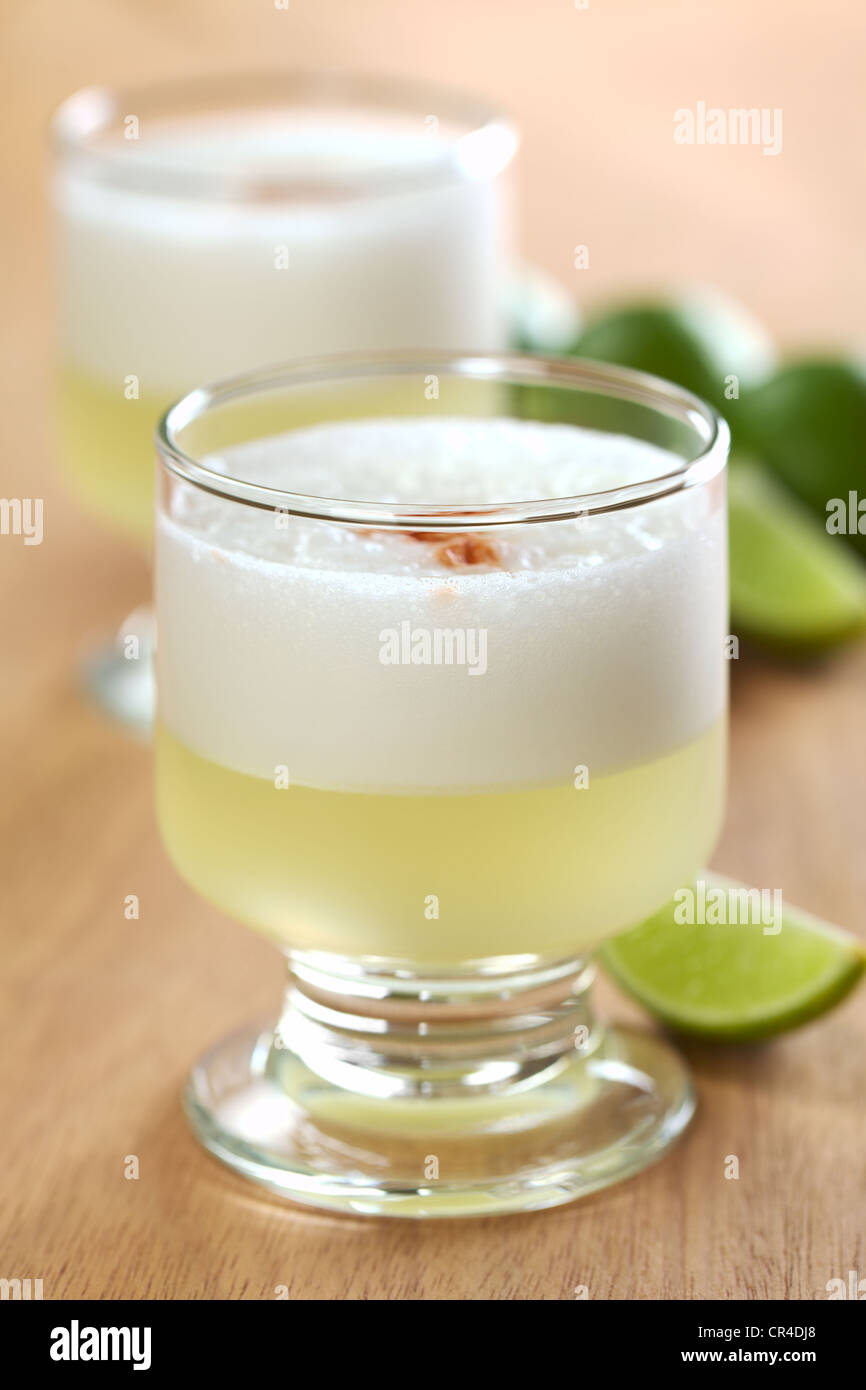 Peruvian cocktail called Pisco Sour made of Pisco, lime juice, syrup and egg white Stock Photo