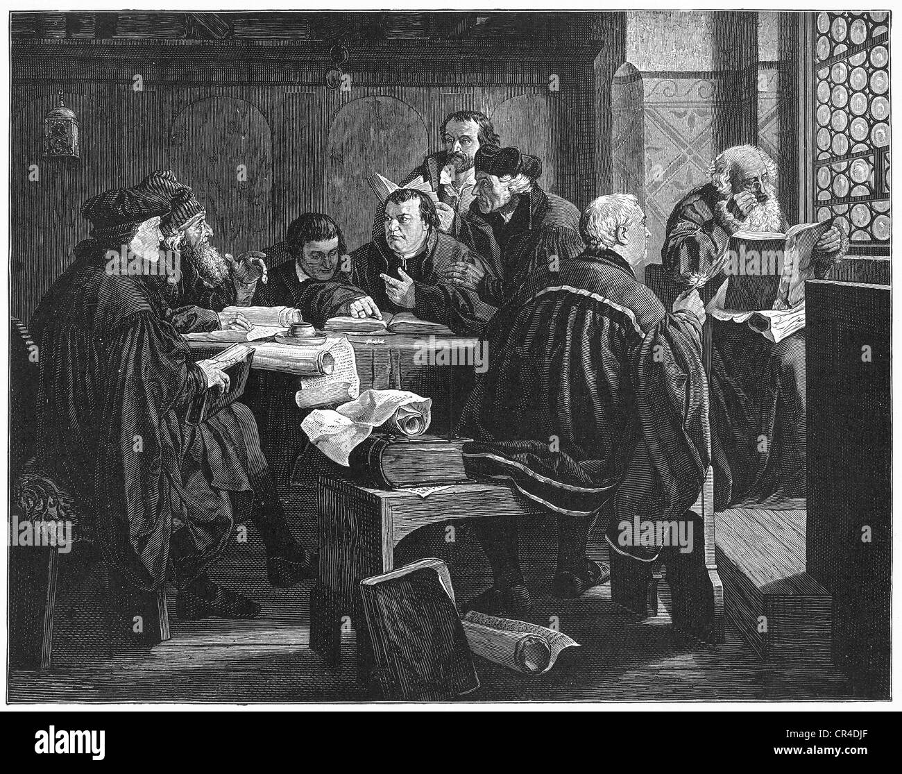 Martin Luther is translating the Holy Bible from Latin to German together with friends in Wartburg castle Stock Photo