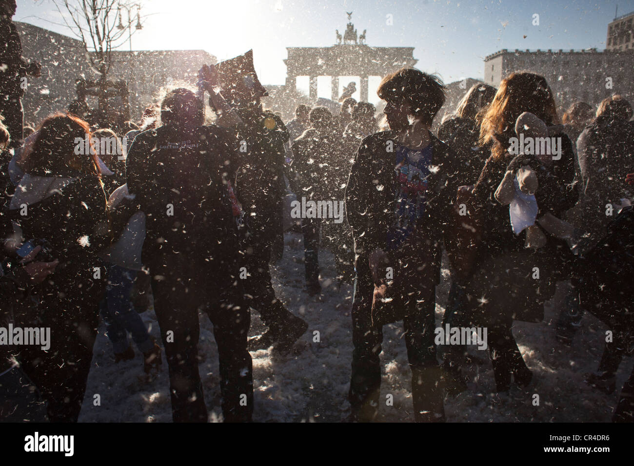 Several hundred people at a flash mob pillow fight arranged through Facebook, at the Brandenburg Gate, Berlin, Germany, Europe Stock Photo