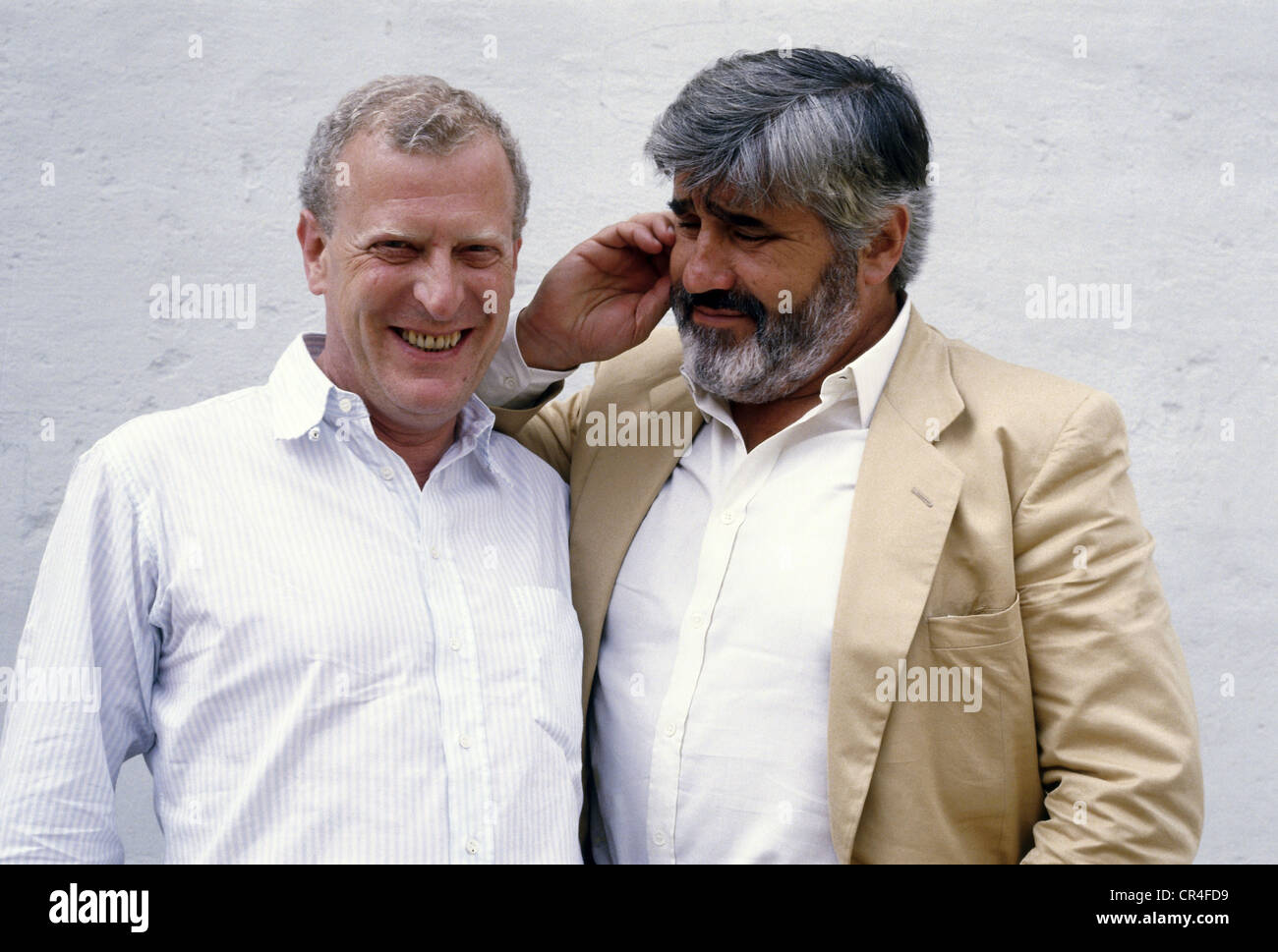 Adorf, Mario  * 8.9.1930, German actor, half length, with Tom Toelle, at press screening of mini series 'Via Mala', Munich, 1985, Stock Photo