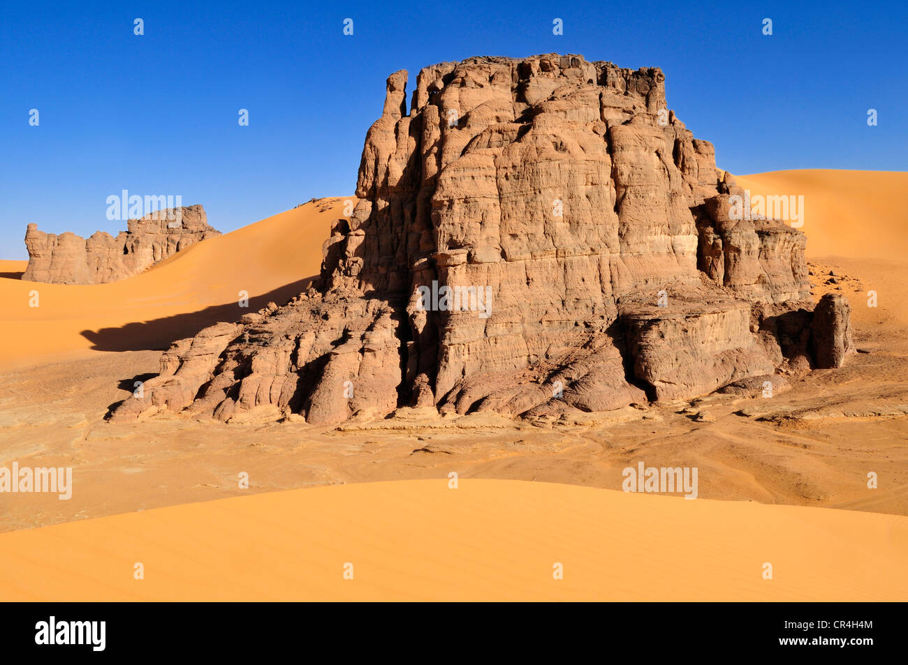 Rock formation in the dunes of Moul N´Aga, Acacus Mountains or Tadrart Acacus range, Tassili n'Ajjer National Park Stock Photo