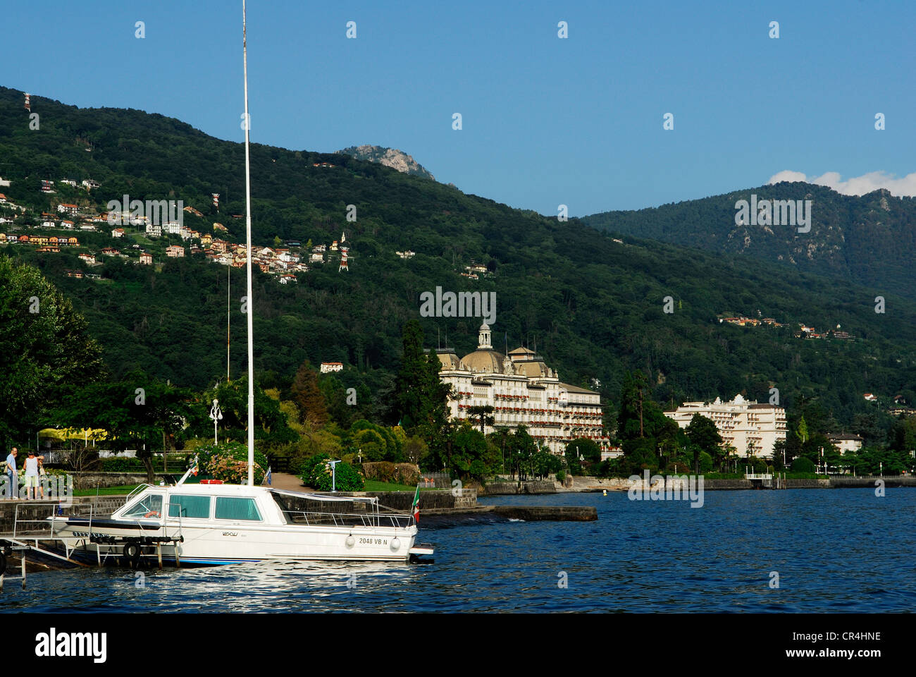 Italy, Piedmont, Stresa, boat mooring on Lake Maggiore, in the background Grand Hotel des Iles Borromees Stock Photo