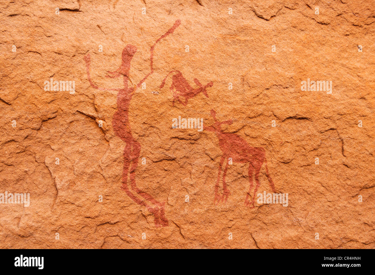 Human with animals, neolithic rock art of the Tadrart, Tassili n'Ajjer National Park, Unesco World Heritage Site, Algeria Stock Photo
