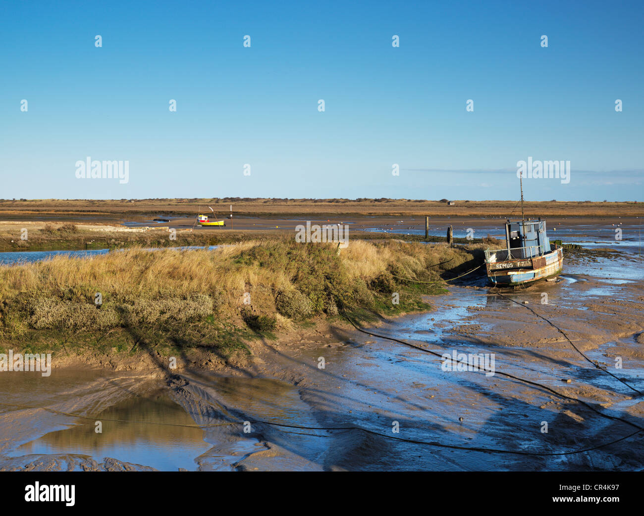 Low tide on a bright winter day at Brancaster Staithe, Norfolk, England Stock Photo