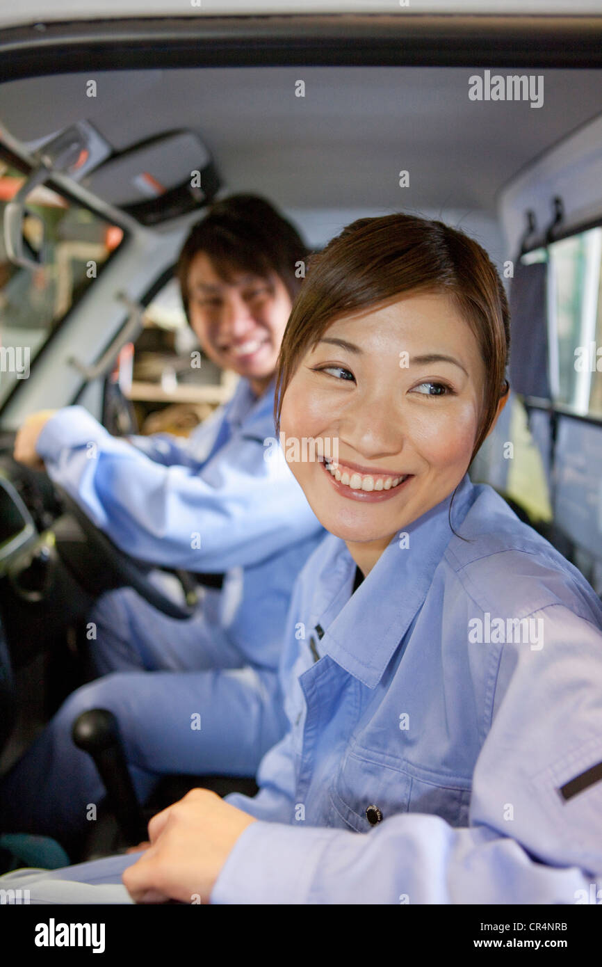 Two Car Mechanics In Car Stock Photo Alamy
