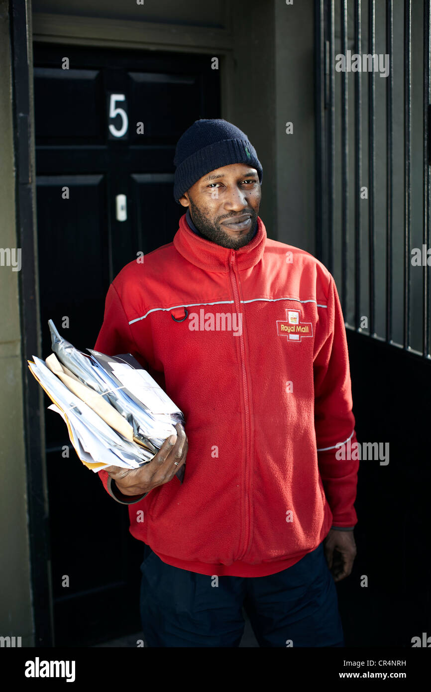 The Great British Postman. Postal worker on the streets of UK. Stock Photo