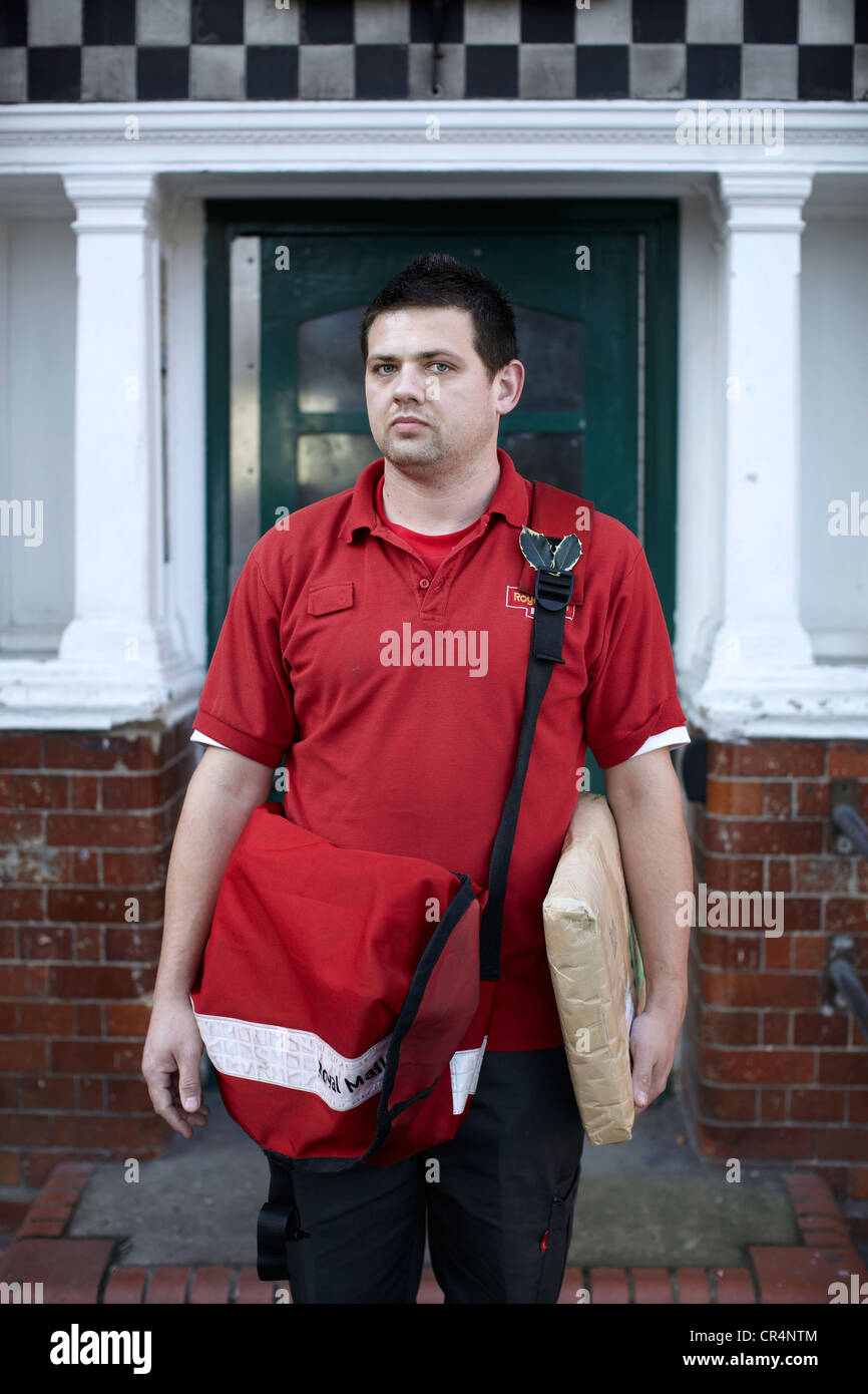 The Great British Postman. Postal worker on the streets of UK. Stock Photo