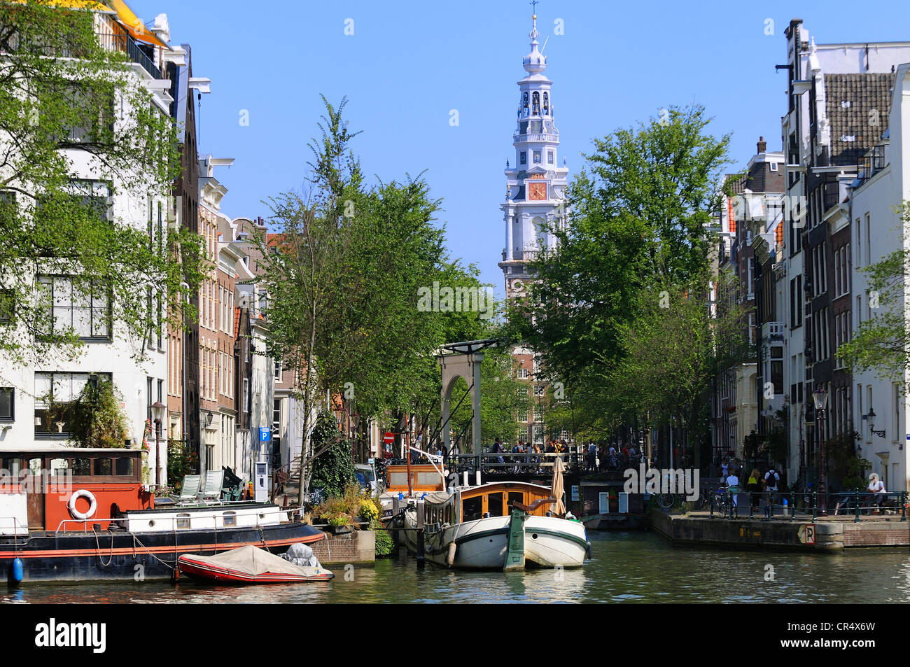 Netherlands, Amsterdam, Groenburgwal Canal and bell tower of Zuiderkerk Church Stock Photo