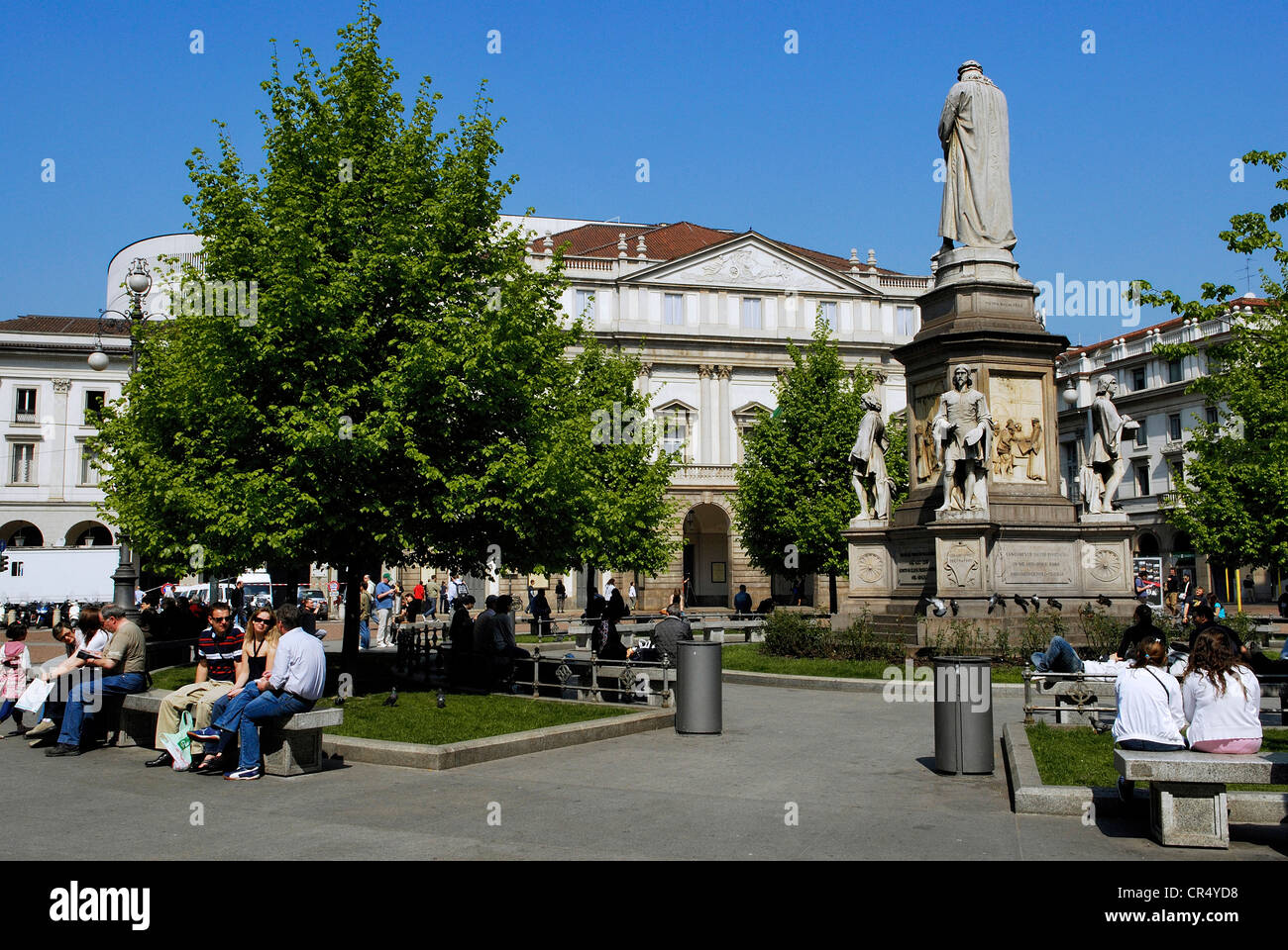 Italy Lombardy Milan Piazza della Scala in middle statue dedicated to Leonardo da Vinci and La Scala Opera House in background Stock Photo