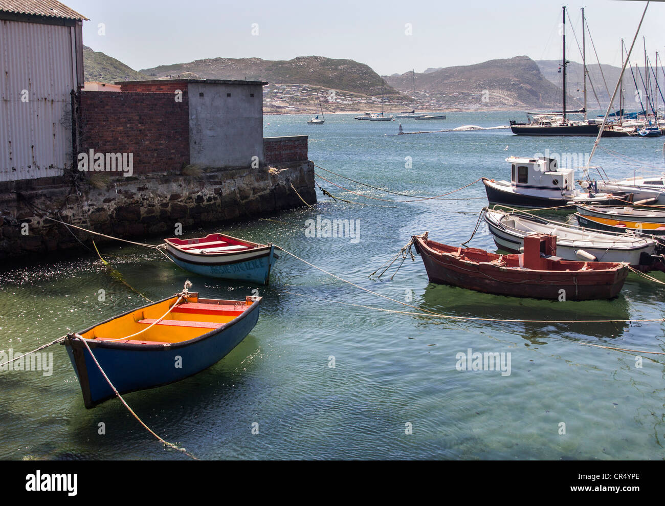 Colourful boats in Simon's Town Harbour which is situated on the Eastern Side of the Cape Peninsula in South Africa Stock Photo