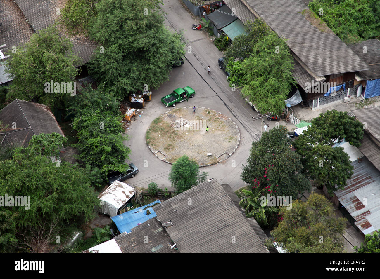 It's a photo of  detail of bangkok streets view from the sky. We can see park, car, trees and roads from the top. Stock Photo