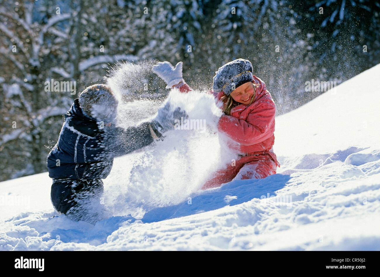 France, Savoie, Les Menuires, Domaine des 3 vallees (The three valleys), children playing in the snow Stock Photo