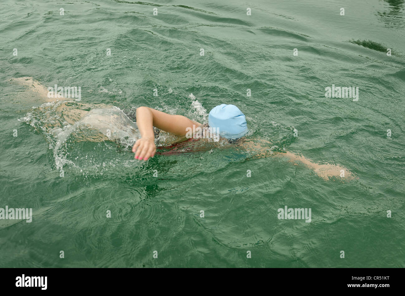 Open water training swimming in fresh water for the Speedo league in deep  weed free lake icy cold stroke freestyle Stock Photo - Alamy