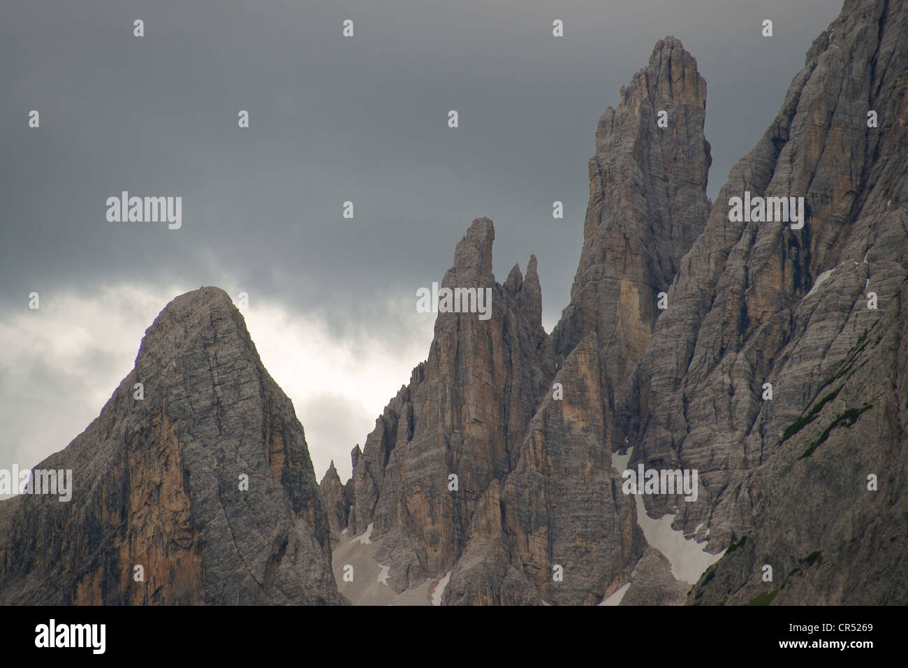 Bad weather clouds over the mountain peaks in the Sexten Dolomites ...