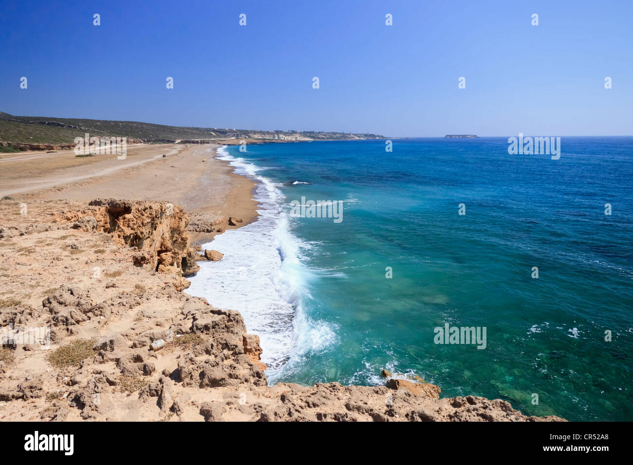 Detached beach near at the south side of Akamas peninsula near Agios Gergios, Paphos, Cyprus. Geronisos island at the background Stock Photo