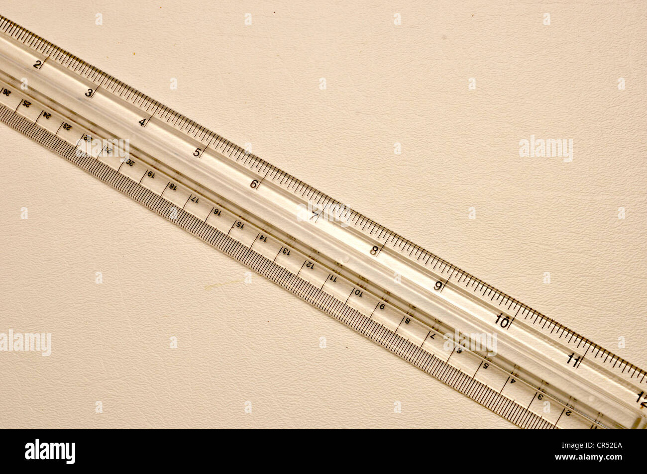 A clear plastic ruler is on a white background. Stock Photo