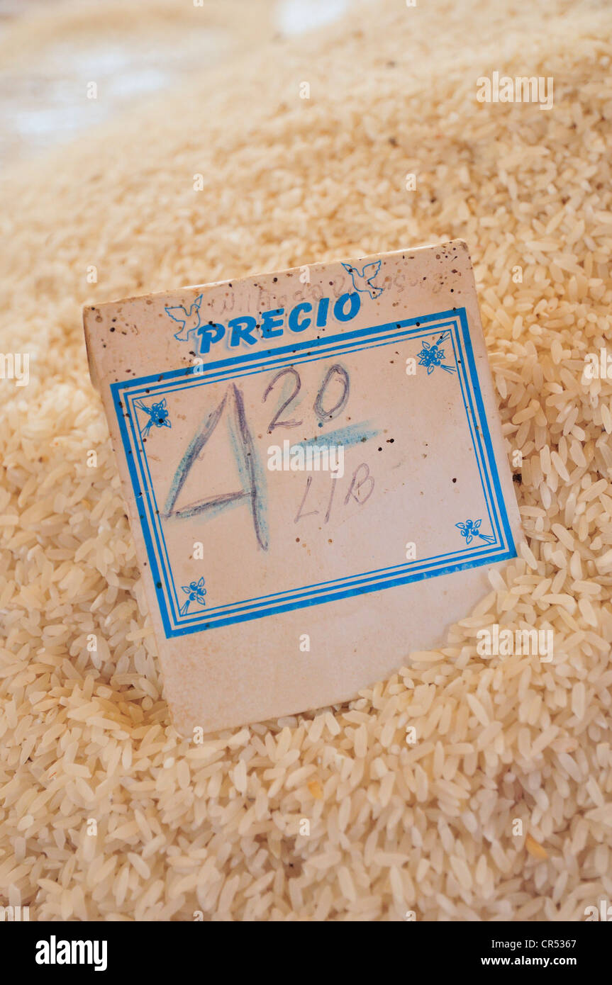 Price tag on a pile on rice at the market of Sancti Spiritus, government-controlled pricing, Cuba, Caribbean Stock Photo
